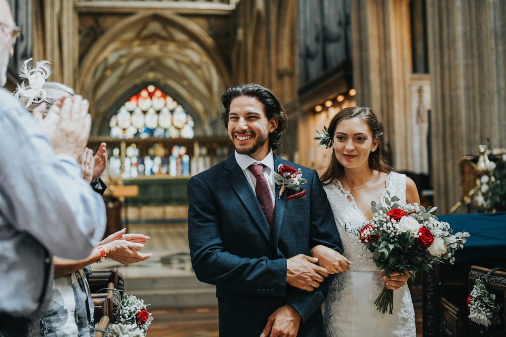 Newly wed couple walking down the aisle